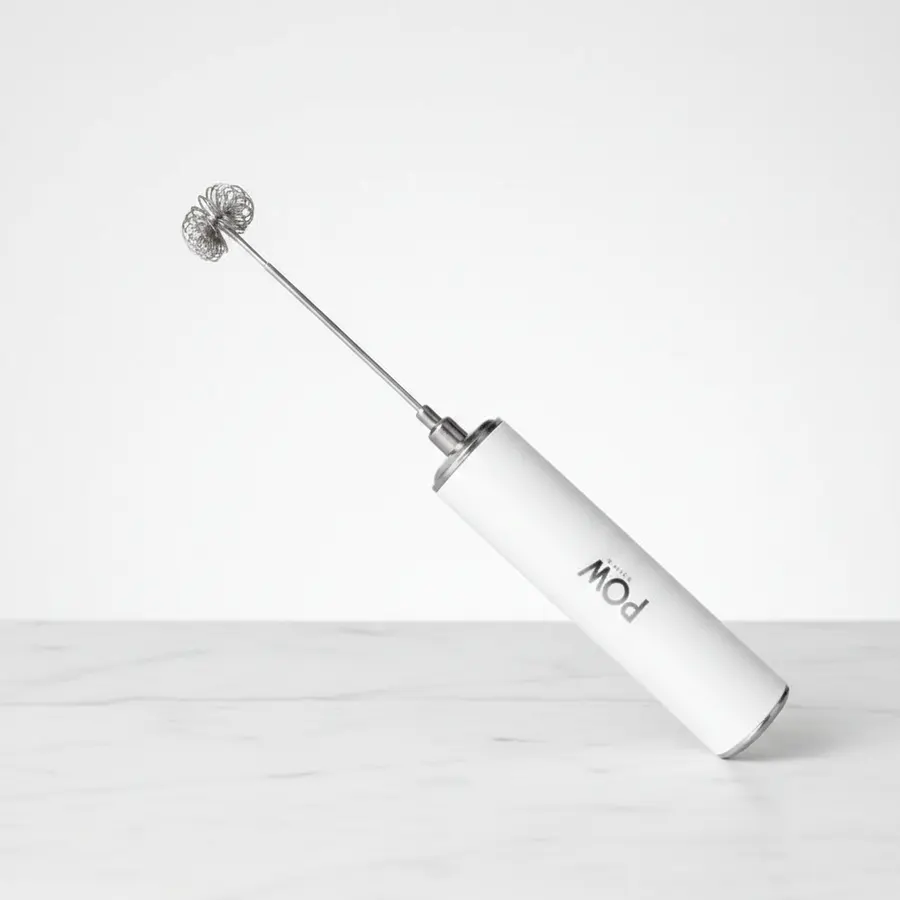 A slim matte pouch of functional coffee ground with mushroom extracts positioned on a minimalist kitchen counter next to a...
