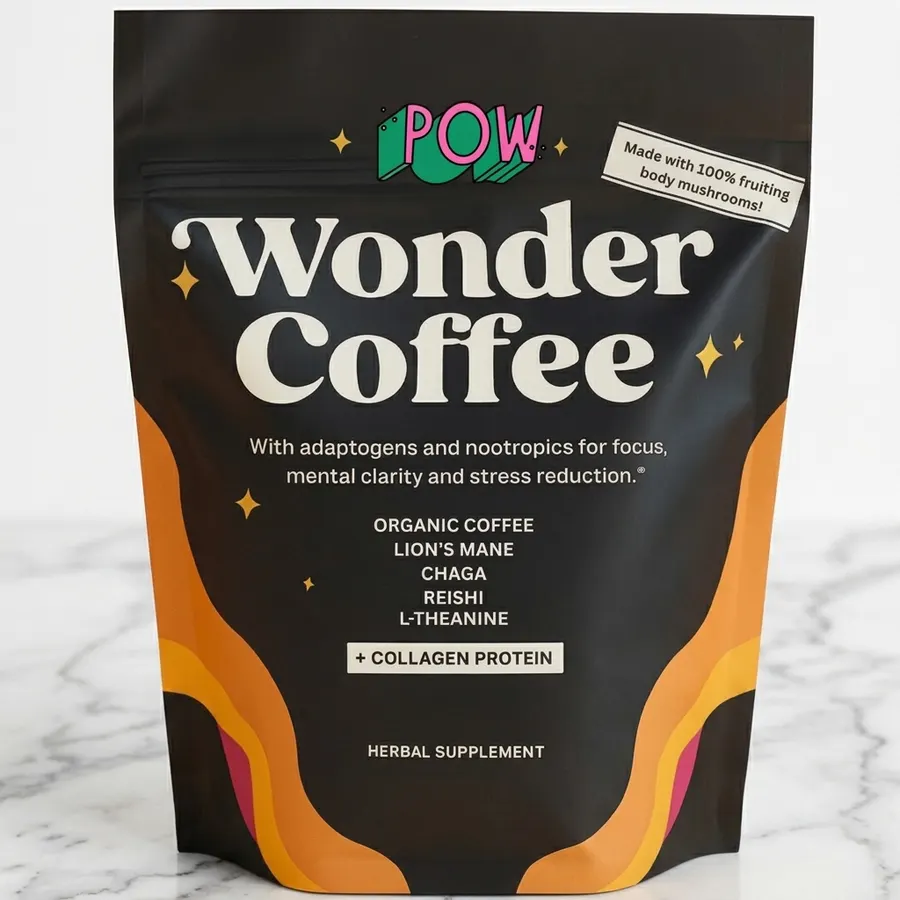 A matte brown pouch of ground functional coffee with visible texture, positioned on a light wood kitchen counter next to a...