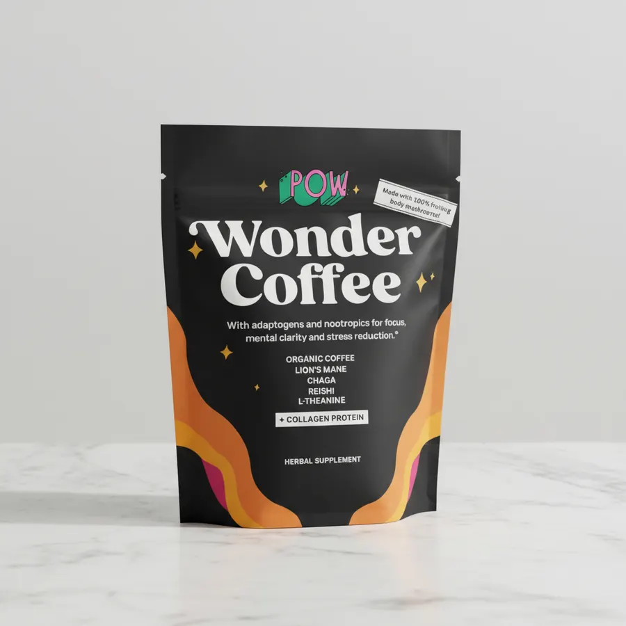 A health-conscious person preparing a functional coffee packet in a bright, clean kitchen, pouring it into a ceramic mug, ...