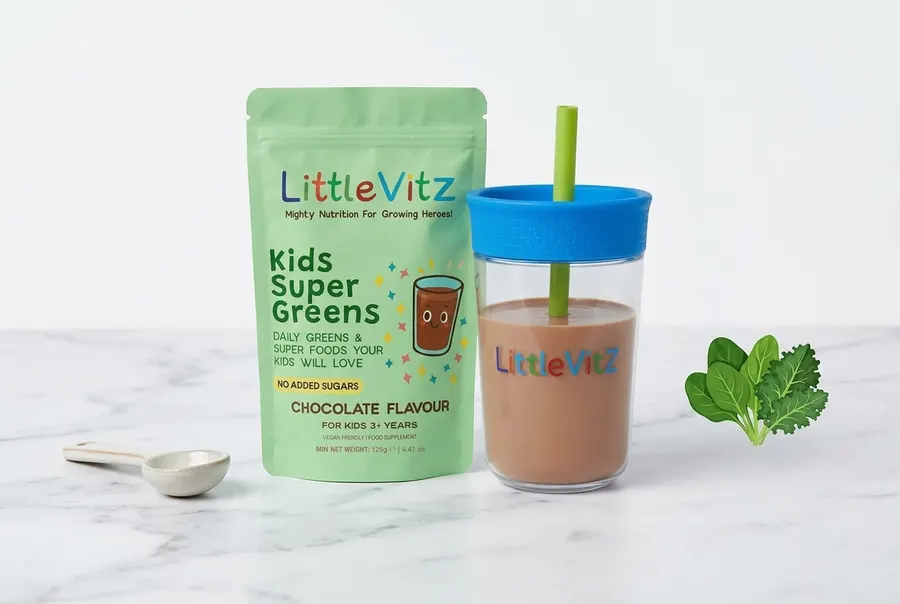 A frosted white jar of kids' greens powder with a soft lime-green accent cap and minimal clean label design, standing upri...