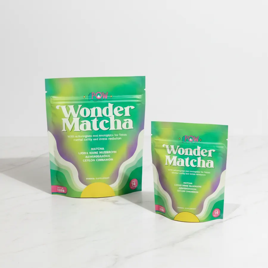 A minimalist desk scene with a steaming mug of dark mushroom coffee and a small ceramic bowl of matcha powder beside it, m...