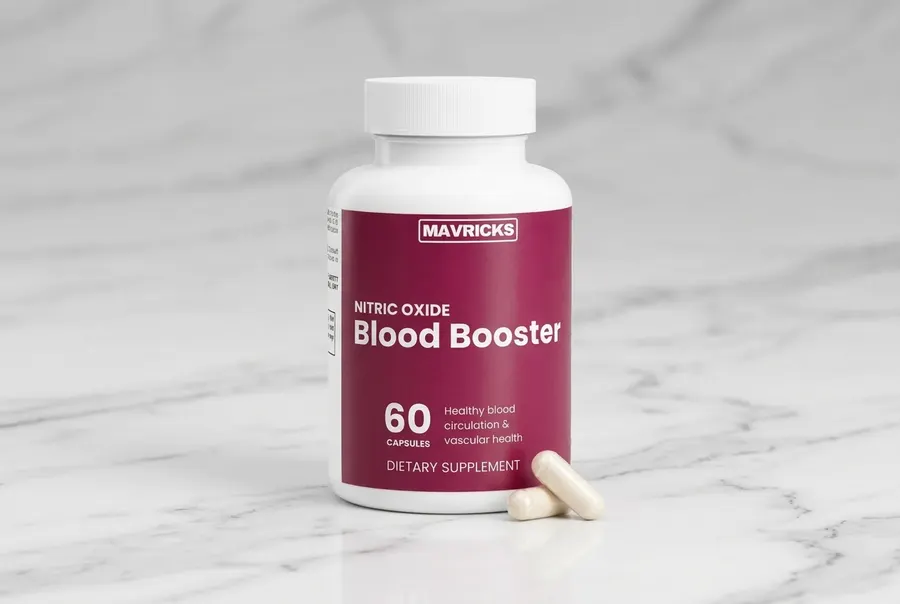 A frosted amber glass bottle of nitric oxide capsules positioned on a clean kitchen counter beside a stainless steel water...