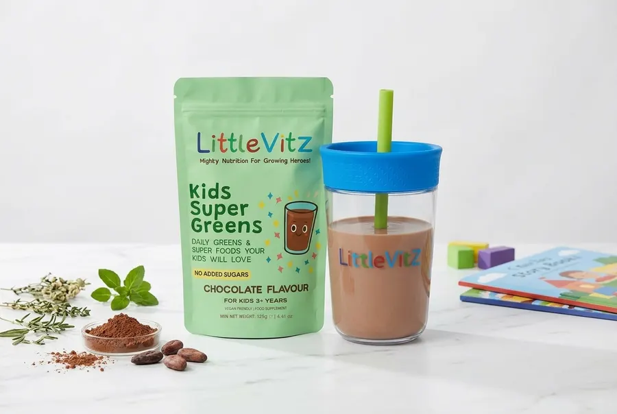 A frosted glass jar of chocolate greens powder for children centered on a seamless two-tone backdrop, one panel in soft sa...