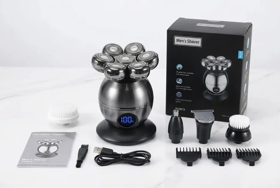 A compact electric multi-head skull shaver with five visible attachment heads standing upright centered in frame at 60% he...