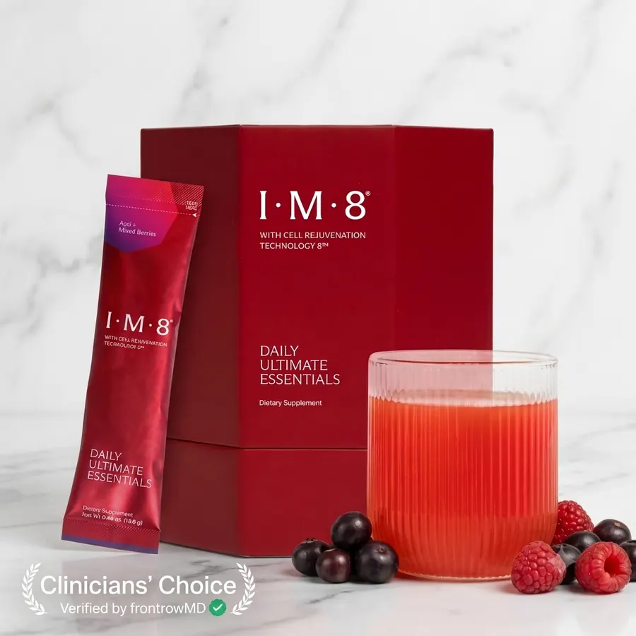 A single matte sachet of multivitamin supplement next to a ceramic coffee cup on a bright kitchen counter, top-down view, ...