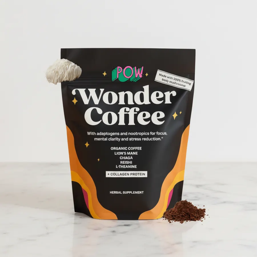 Close-up of Wonder Coffee being poured into a white ceramic mug, rich dark liquid with slight steam, wooden surface, natur...