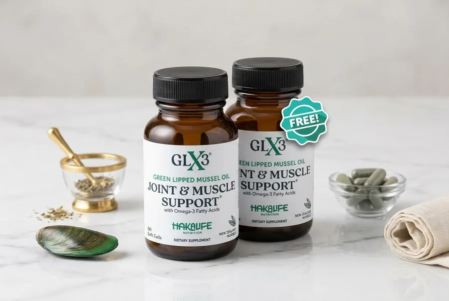 A frosted green glass bottle of omega-3 supplement softgels sits upright on a clean white marble kitchen counter beside a ...