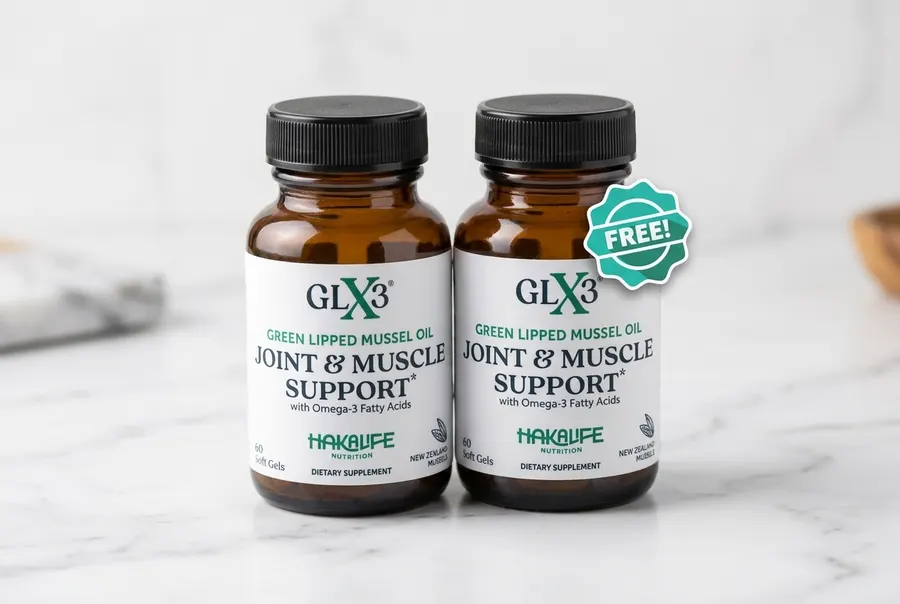 A frosted amber softgel capsule of omega-3 supplement centered on clean white surface, photographed straight-on at eye lev...