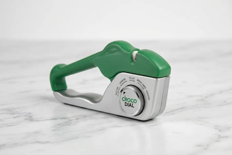 The Croco Dial knife sharpener positioned upright on a clean countertop, all five rotating tungsten carbide and ceramic sl...