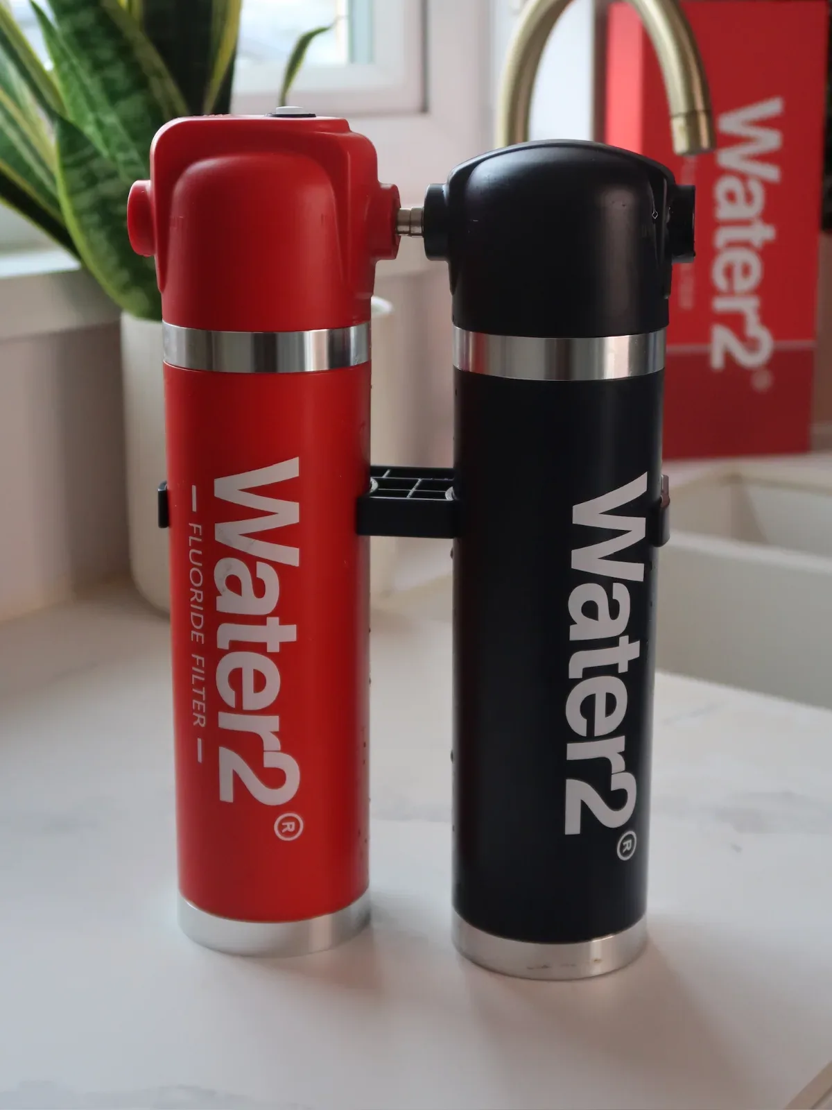 photograph of Water2 in a real in-use moment — the product placed or held prominently in a warm, authentic everyday settin...