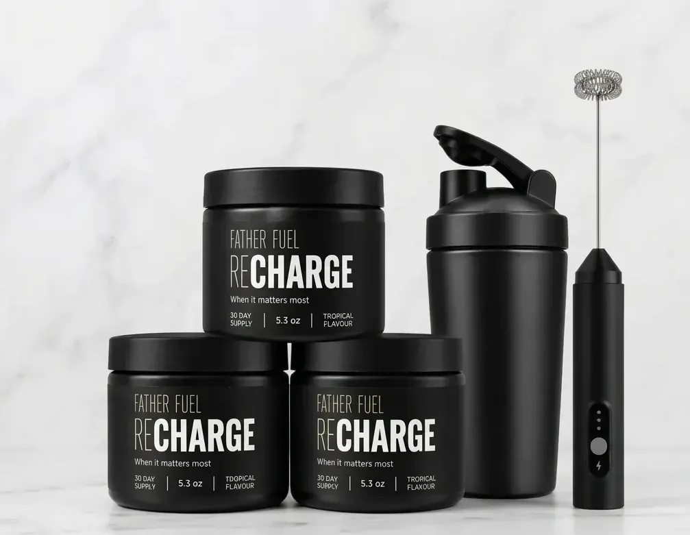A single frosted white canister of energy supplement powder sits centered on a wood kitchen counter next to a filled shake...